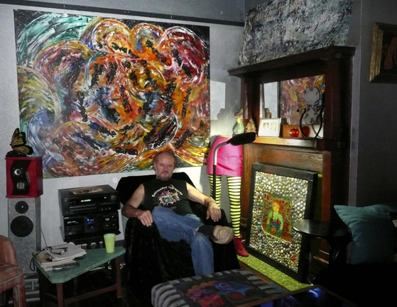 William Solis at home with his art